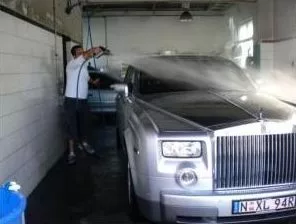 Picture of a Rolls Royce getting a car wash